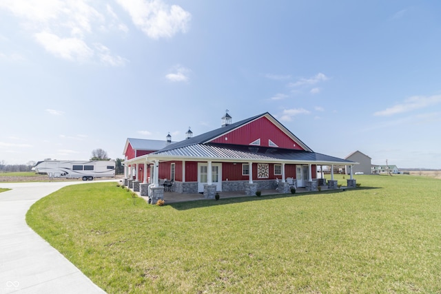 8267 W County Road 350 S, Shirley, IN 47384 - view of front of house featuring stone siding, metal roof, a standing seam roof, a front lawn, and driveway