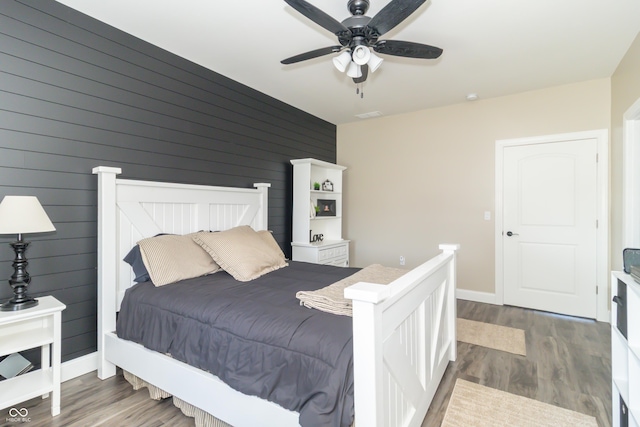 8267 W County Road 350 S, Shirley, IN 47384 - bedroom featuring baseboards, ceiling fan, and wood finished floors