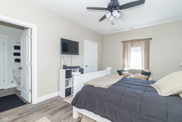 8267 W County Road 350 S, Shirley, IN 47384 - bedroom with a ceiling fan, ensuite bath, baseboards, and wood finished floors