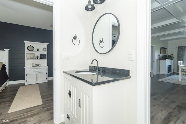 8267 W County Road 350 S, Shirley, IN 47384 - bathroom featuring baseboards, wood finished floors, vanity, and beam ceiling