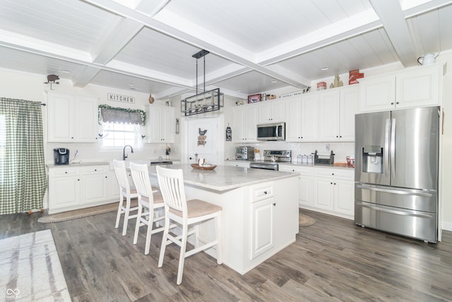 8267 W County Road 350 S, Shirley, IN 47384 - kitchen with dark wood finished floors, white cabinets, beam ceiling, and appliances with stainless steel finishes