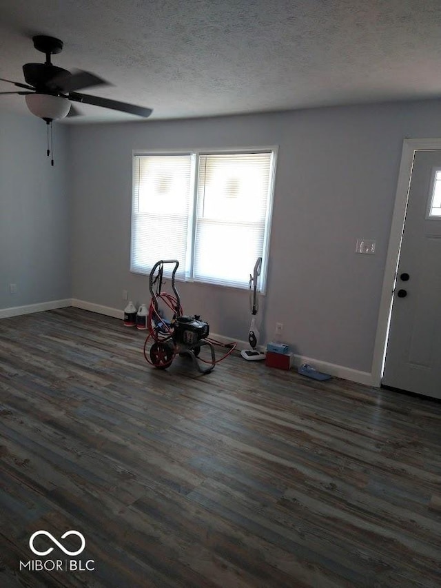 1447 Rebecca Ln, Franklin, IN 46131 - unfurnished living room with ceiling fan, wood finished floors, and a textured ceiling