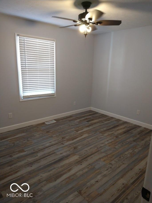 1447 Rebecca Ln, Franklin, IN 46131 - spare room featuring a ceiling fan and dark wood-style floors