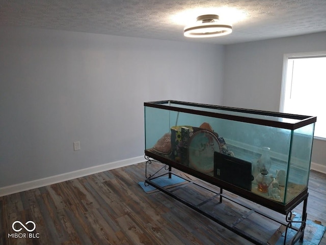 1447 Rebecca Ln, Franklin, IN 46131 - miscellaneous room with a textured ceiling and wood finished floors