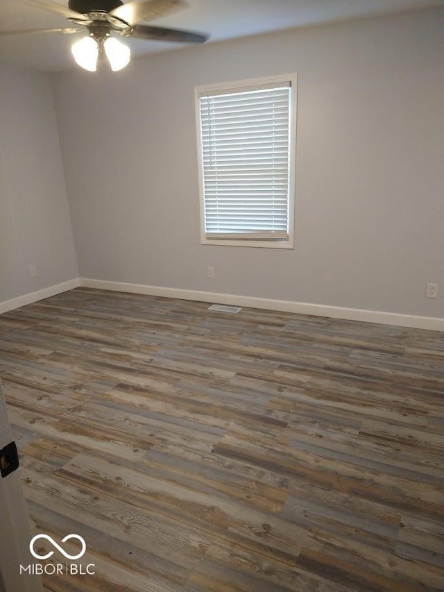 1447 Rebecca Ln, Franklin, IN 46131 - unfurnished room with wood finished floors and a ceiling fan
