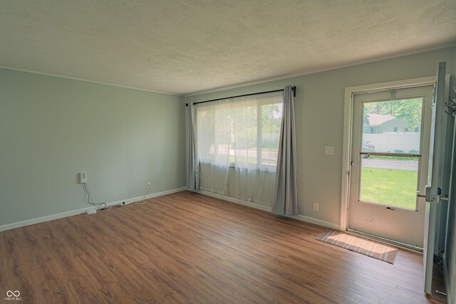 2612 Midlex Ct, Lafayette, IN 47904 - unfurnished room featuring a textured ceiling and wood finished floors