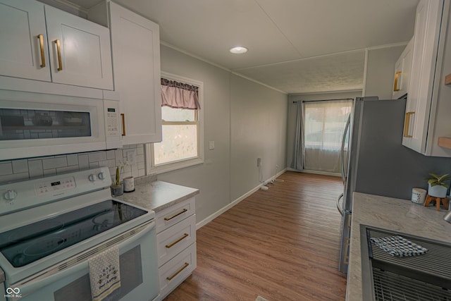 2612 Midlex Ct, Lafayette, IN 47904 - kitchen featuring white appliances, healthy amount of natural light, crown molding, wood finished floors, and white cabinetry