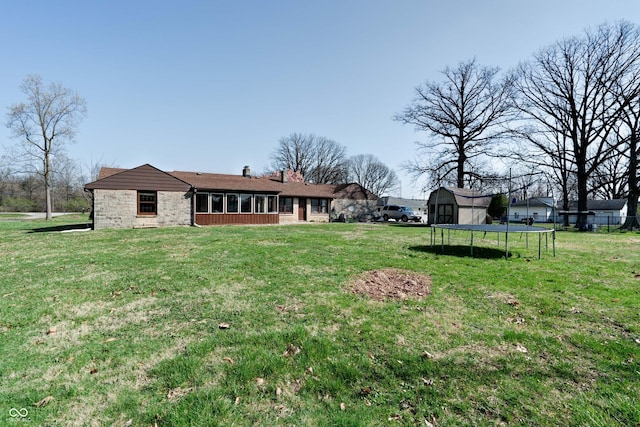 6047 W 56th St, Indianapolis, IN 46254 - view of yard with a sunroom and a trampoline