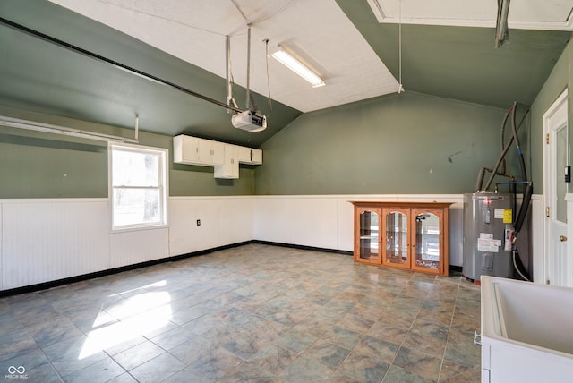 6047 W 56th St, Indianapolis, IN 46254 - garage with french doors, electric water heater, a garage door opener, and wainscoting