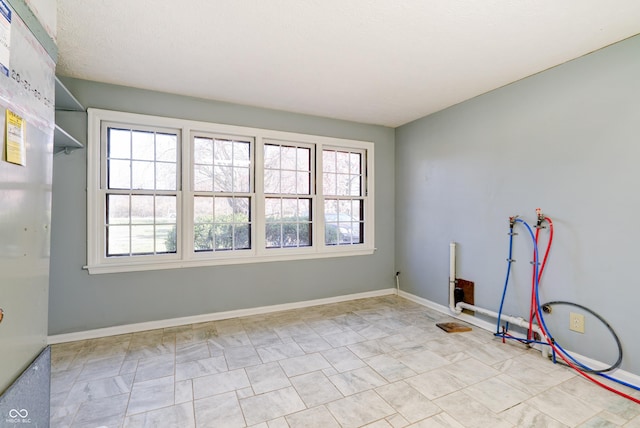 6047 W 56th St, Indianapolis, IN 46254 - empty room featuring baseboards and a healthy amount of sunlight