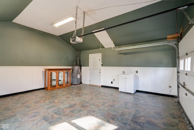 6047 W 56th St, Indianapolis, IN 46254 - garage with a wainscoted wall, a garage door opener, electric water heater, and french doors