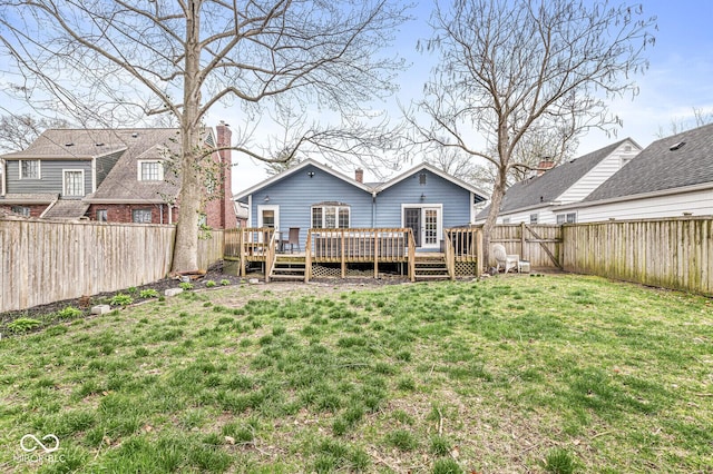 5028 Graceland Ave, Indianapolis, IN 46208 - rear view of property featuring a fenced backyard, a wooden deck, and a yard