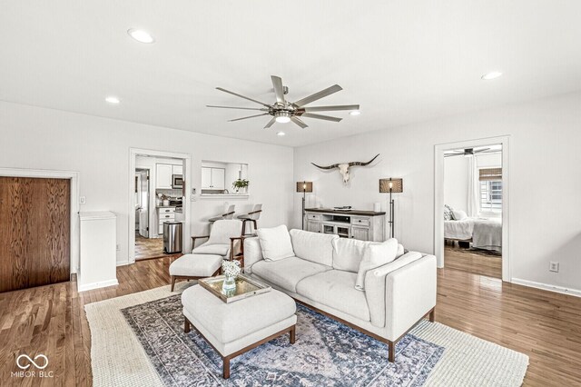 5028 Graceland Ave, Indianapolis, IN 46208 - living area featuring a ceiling fan, baseboards, recessed lighting, and wood finished floors