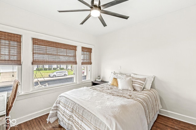 5028 Graceland Ave, Indianapolis, IN 46208 - bedroom with baseboards, ceiling fan, and wood finished floors