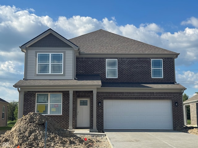 view of front of home featuring brick siding, roof with shingles, a garage, and driveway