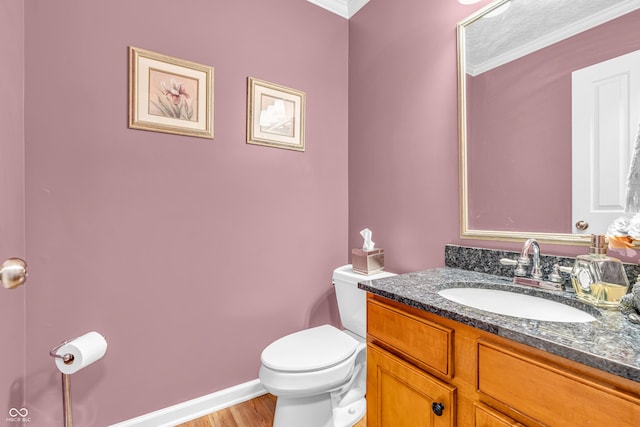 6071 Sugar Pine Dr, Avon, IN 46123 - bathroom with toilet, crown molding, vanity, wood finished floors, and baseboards