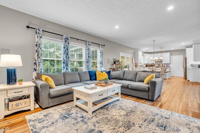 6071 Sugar Pine Dr, Avon, IN 46123 - living room featuring light wood-type flooring, recessed lighting, and a textured ceiling