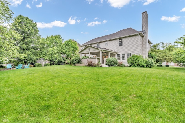 6071 Sugar Pine Dr, Avon, IN 46123 - rear view of house with a chimney and a lawn