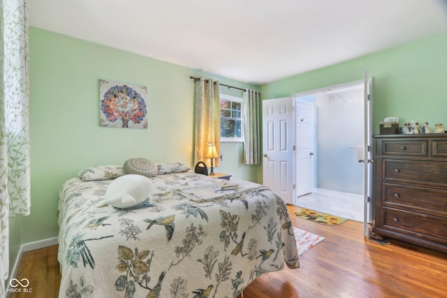 2910 S Sheridan Ave, Indianapolis, IN 46203 - bedroom featuring wood finished floors and baseboards