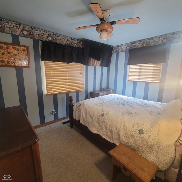 1024 Foltz St, Indianapolis, IN 46241 - bedroom with carpet, baseboards, wallpapered walls, visible vents, and a ceiling fan