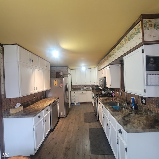 1024 Foltz St, Indianapolis, IN 46241 - kitchen with white cabinetry, a sink, stainless steel appliances, and decorative backsplash
