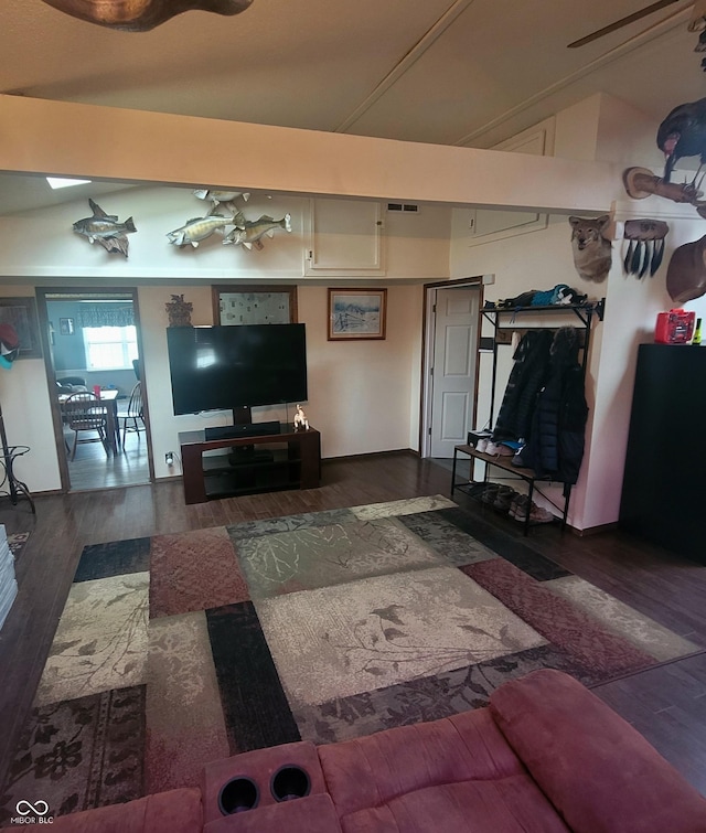 1024 Foltz St, Indianapolis, IN 46241 - living room with visible vents, wood finished floors, and vaulted ceiling