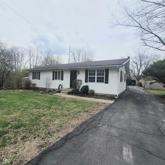 1024 Foltz St, Indianapolis, IN 46241 - view of front of property featuring driveway, fence, and a front lawn