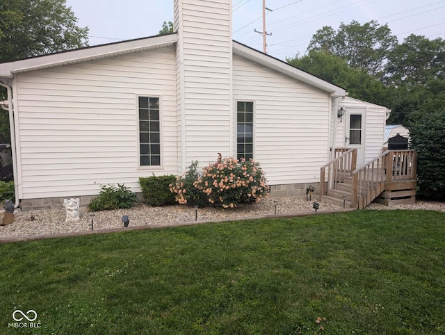 1024 Foltz St, Indianapolis, IN 46241 - view of property exterior with a yard, a chimney, and crawl space