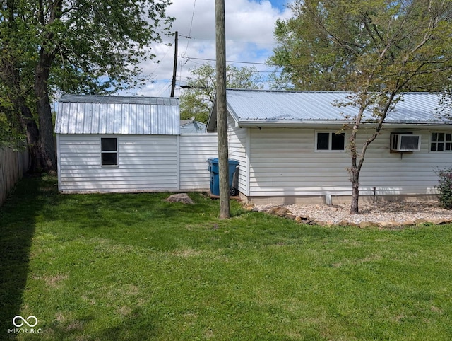 1024 Foltz St, Indianapolis, IN 46241 - view of home's exterior featuring a metal roof and a wall mounted AC