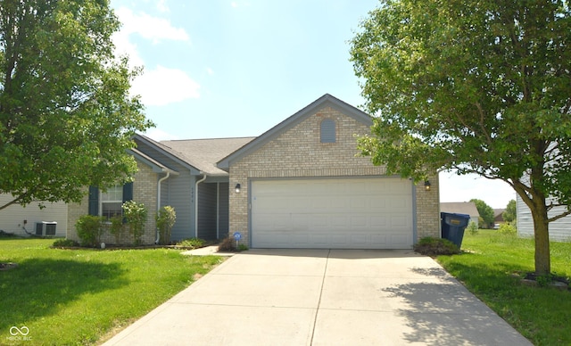 5406 Shamus Dr, Indianapolis, IN 46235 - ranch-style house featuring brick siding, driveway, a front yard, and an attached garage