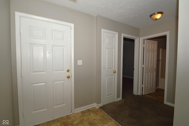 5406 Shamus Dr, Indianapolis, IN 46235 - foyer entrance with baseboards and a textured ceiling