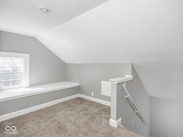 317 E 37th St, Indianapolis, IN 46205 - bonus room featuring baseboards, carpet floors, and vaulted ceiling