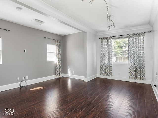 317 E 37th St, Indianapolis, IN 46205 - empty room with baseboards, wood finished floors, and a healthy amount of sunlight