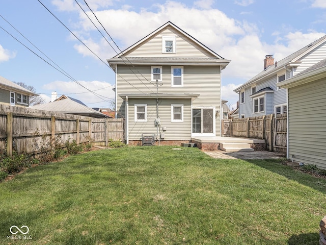 317 E 37th St, Indianapolis, IN 46205 - rear view of house with a fenced backyard, a patio area, and a yard