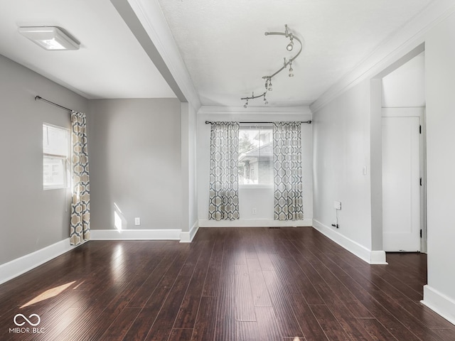 317 E 37th St, Indianapolis, IN 46205 - empty room with track lighting, crown molding, baseboards, and wood finished floors