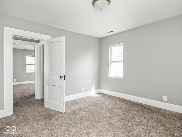 317 E 37th St, Indianapolis, IN 46205 - spare room with carpet, baseboards, and visible vents