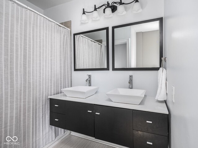 317 E 37th St, Indianapolis, IN 46205 - full bath featuring double vanity and a sink