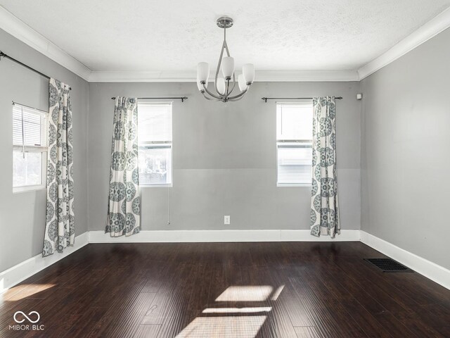 317 E 37th St, Indianapolis, IN 46205 - spare room with an inviting chandelier, hardwood / wood-style flooring, a textured ceiling, and visible vents