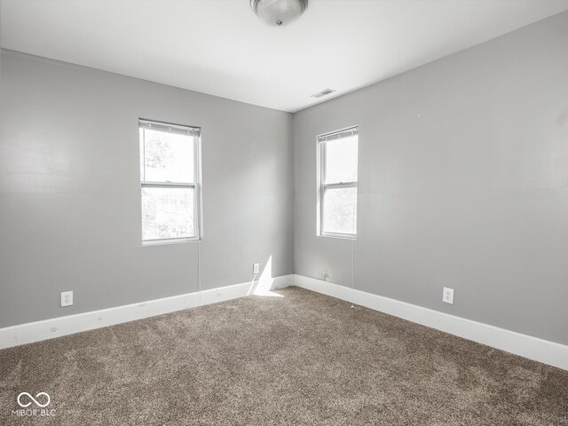 317 E 37th St, Indianapolis, IN 46205 - carpeted spare room with baseboards and visible vents