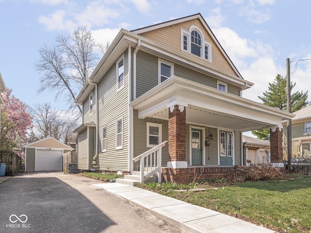 317 E 37th St, Indianapolis, IN 46205 - traditional style home featuring an outdoor structure, a front lawn, a detached garage, central AC unit, and a porch