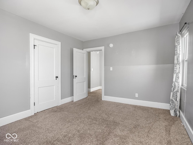 317 E 37th St, Indianapolis, IN 46205 - unfurnished bedroom with carpet floors and baseboards