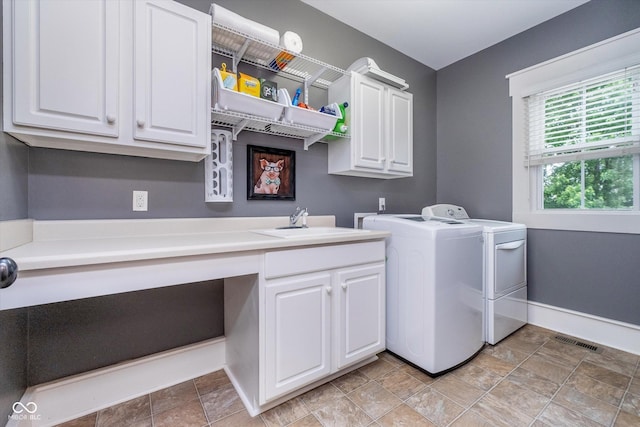 2353 Woodcreek Crossing Blvd, Avon, IN 46123 - laundry area featuring independent washer and dryer, cabinet space, a desk, baseboards, and stone finish flooring