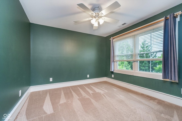 2353 Woodcreek Crossing Blvd, Avon, IN 46123 - spare room featuring carpet flooring, baseboards, and a ceiling fan