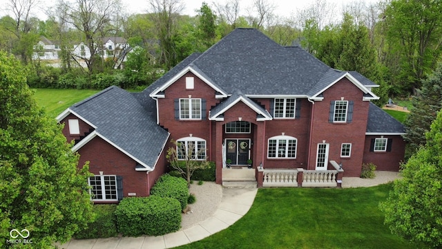 633 Foxboro Dr, Avon, IN 46123 - view of front of property with brick siding, a shingled roof, and a front yard