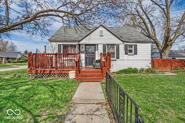 1441 N Euclid Ave, Indianapolis, IN 46201 - bungalow-style home featuring a wooden deck, fence, and a front lawn