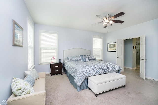 carpeted bedroom with baseboards and ceiling fan