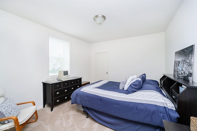 bedroom with light colored carpet