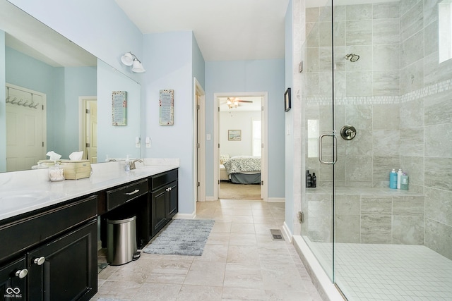 ensuite bathroom featuring double vanity, ceiling fan, visible vents, a shower stall, and ensuite bath