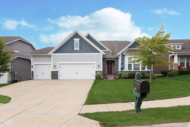 craftsman-style house featuring an attached garage, concrete driveway, a front lawn, and stone siding