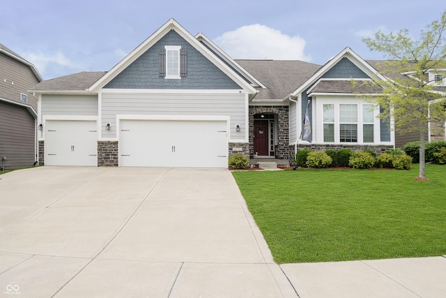 craftsman-style house featuring an attached garage, a front lawn, stone siding, and concrete driveway
